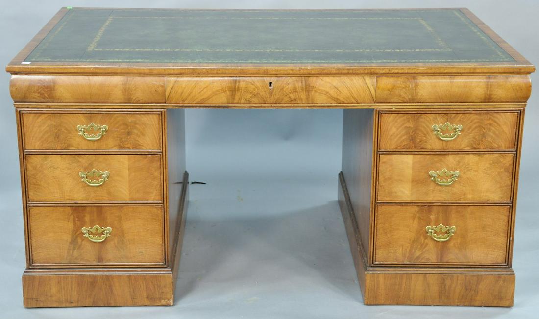 George III mahogany kneehole desk with green tooled: George III mahogany kneehole desk with green tooled leather top and door on reverse, 19th century. ht. 29 1/2 in., top: 33 1/2" x 57 1/2".