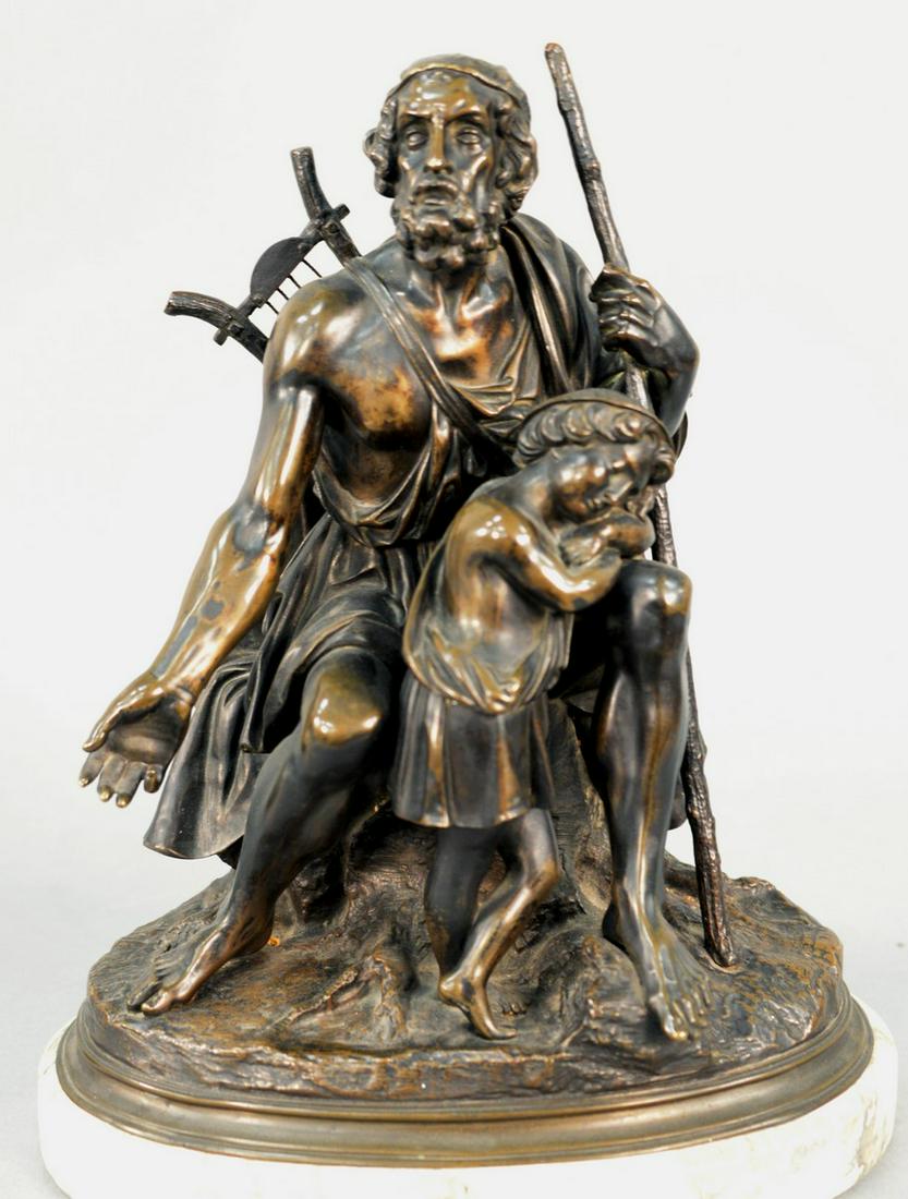Bronze Sculpture of a Man with Walking Stick, wearing a (1 of 3)