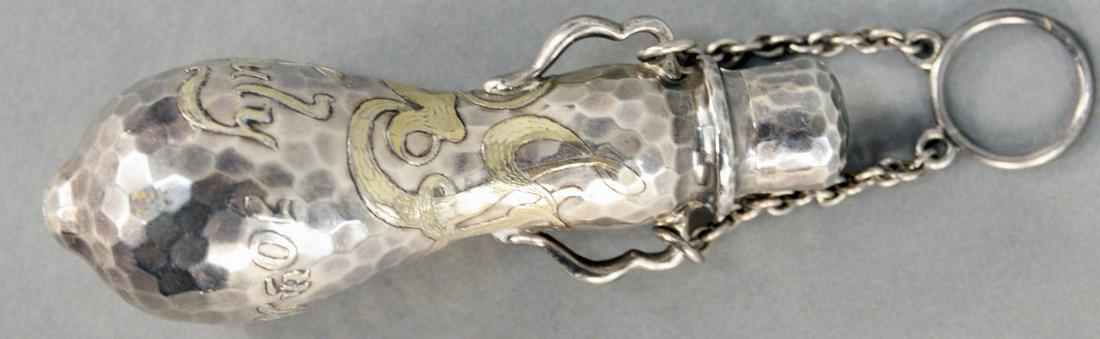 Tiffany and Company Sterling Vinaigrette Perfume: Tiffany and Company Sterling Vinaigrette Perfume Pendant Bottle, hand hammered silver with gold wash decoration, marked July 10th 1882. height 3 1/4 inches.