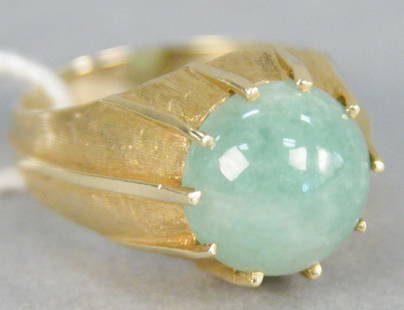 14K gold ring with round cabochon cut jadeite, stone: 14K gold ring with round cabochon cut jadeite, stone diameter 12.2 millimeters. size 8 1/2.