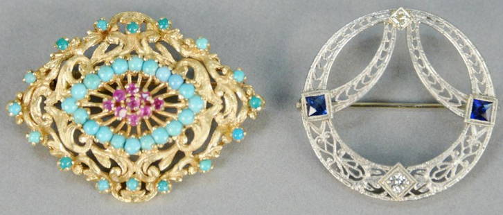 Two gold brooches, 14K white gold circle brooch with: Two gold brooches, 14K white gold circle brooch with blue sapphires and two diamonds along with a brooch with turquoise and red stones. total weight 14.7 grams.