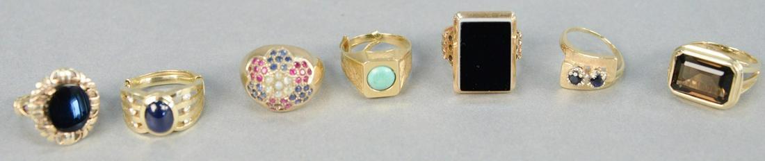 Six gold rings with stones, one with blue stone and: Six gold rings with stones, one with blue stone and small diamonds. 38.7 total grams.