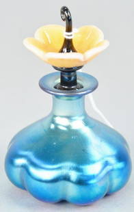 Steuben blue aurene perfume bottle, having pink jade: Steuben blue aurene perfume bottle, having pink jade flower stoppers. ht. 4 1/4 in.