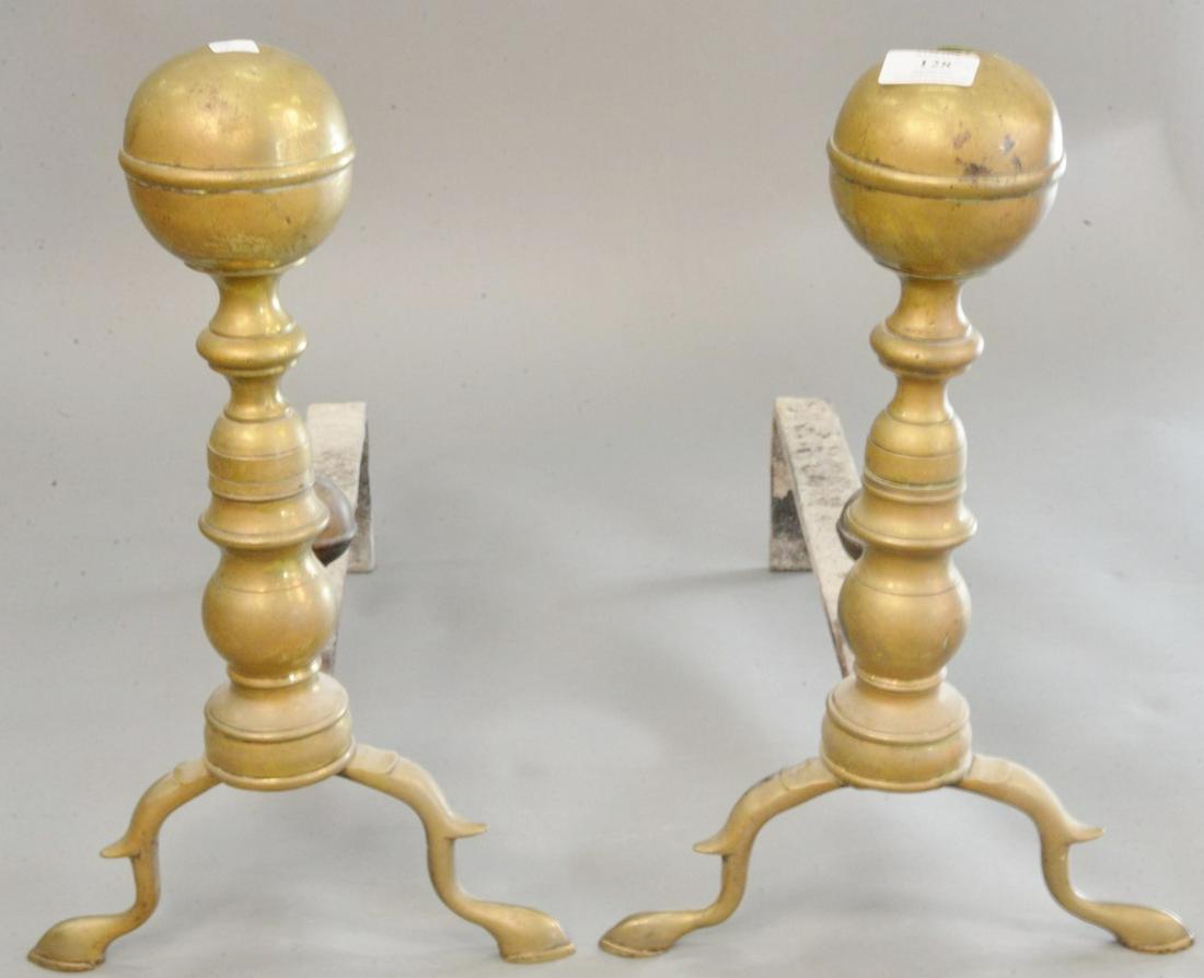 Pair of brass cannonball top andirons, with log stops, (1 of 3)