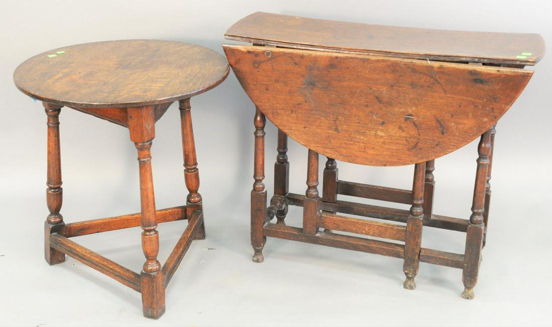 Two piece lot, to include oak circular three leg table (1 of 4)