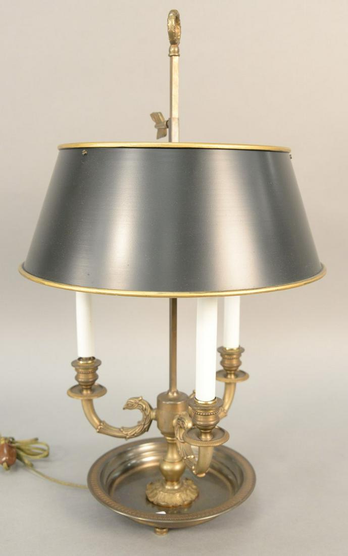 French brass Bouillotte table lamp with adjustable tole: French brass Bouillotte table lamp with adjustable tole shade. ht. 24 in. Provenance: Former home of Mel Gibson, Old Mill Rd, Greenwich, CT