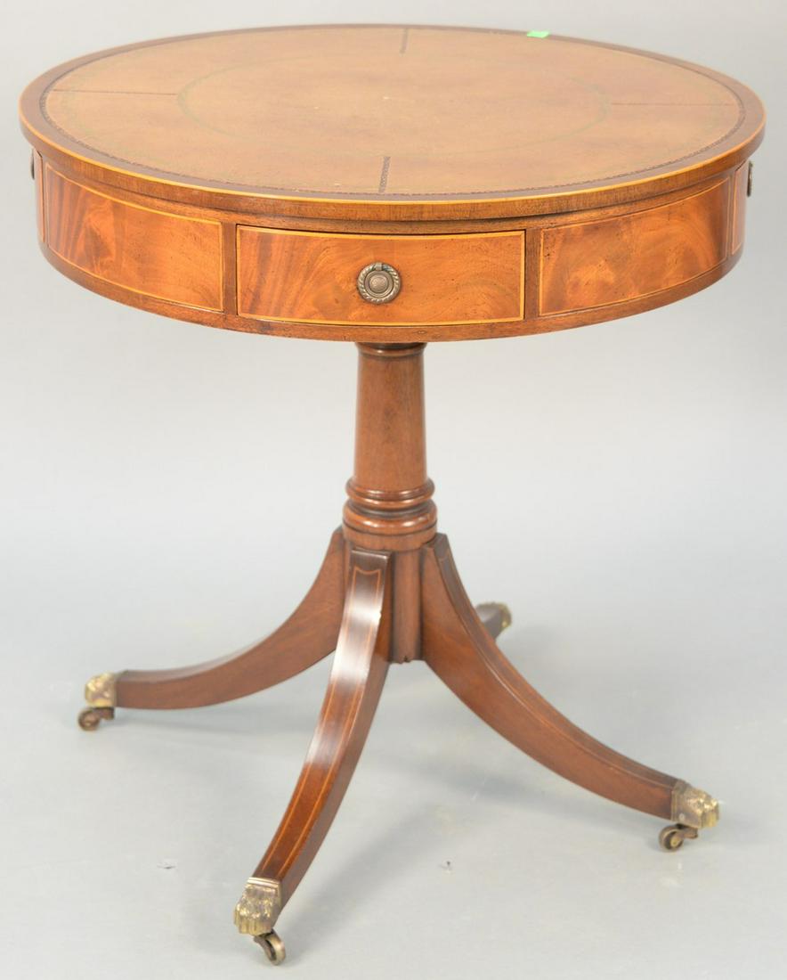 Custom mahogany drum table with leather top, four: Custom mahogany drum table with leather top, four drawers and revolving top. ht. 29 in., dia. 28 in. Provenance: Estate of William and Teresa Patton, Lake Ave Greenwich, CT