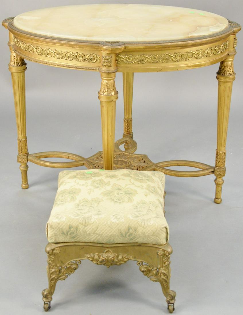 Two piece lot to include Louis XVI style oval table: Two piece lot to include Louis XVI style oval table gilt with metal mounts, onyx top and iron stool. ht. 27 in., top: 25 1/2" x 35".