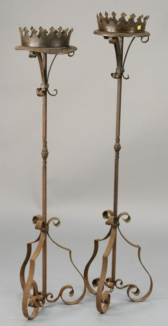Pair of large iron floor candle prickets, crown form: Pair of large iron floor candle prickets, crown form gallery on top. ht. 55 in. Provenance: Former home of Mel Gibson, Old Mill Rd, Greenwich, CT