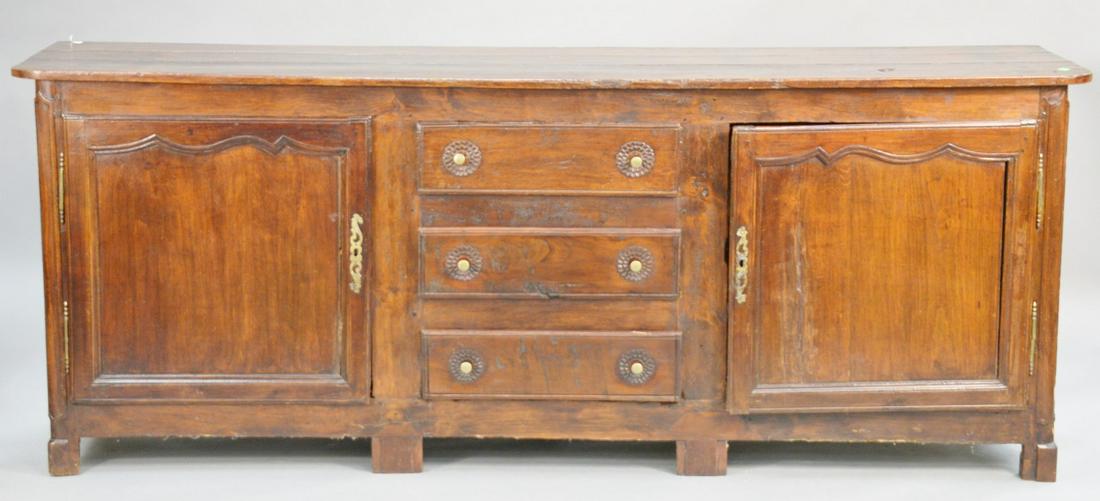 Primitive Jacobean style server having three drawers,: Primitive Jacobean style server having three drawers, flanked by two doors. ht. 36 in., top: 21" x 91". Provenance: Former home of Mel Gibson, Old Mill Rd, Greenwich, CT