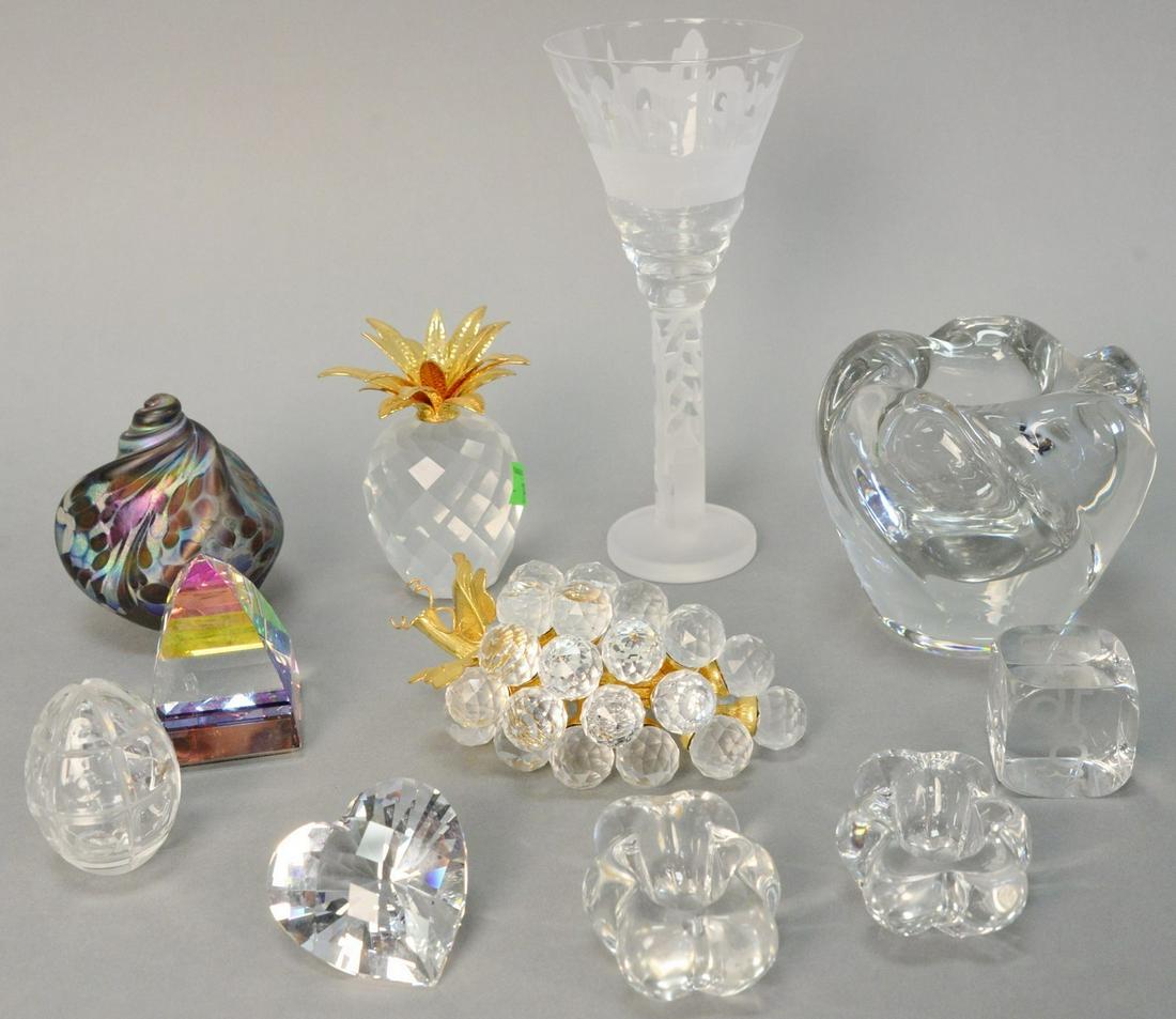 Eleven pieces of crystal and glass, including:: Eleven pieces of crystal and glass, including: Swarovski crystal grapes and pineapple; Faberge crystal egg; Baccarat dice, Daum low vase; two salts, art glass shell; and an etched glass stem glass, si