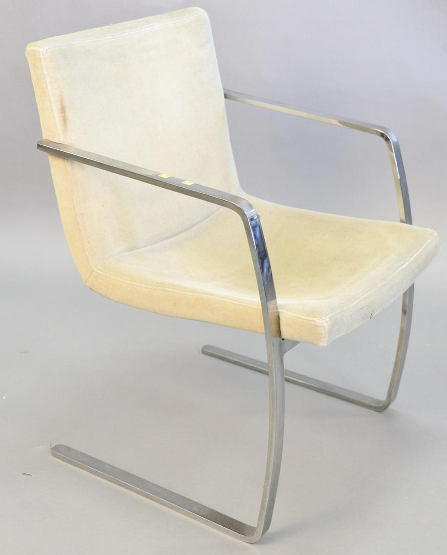 Contemporary armchair, continuous metal arms: Contemporary armchair, continuous metal arms terminating to legs, green upholstery, possibly Knoll, ht. 33", wd. 22 1/2", dp. 18".