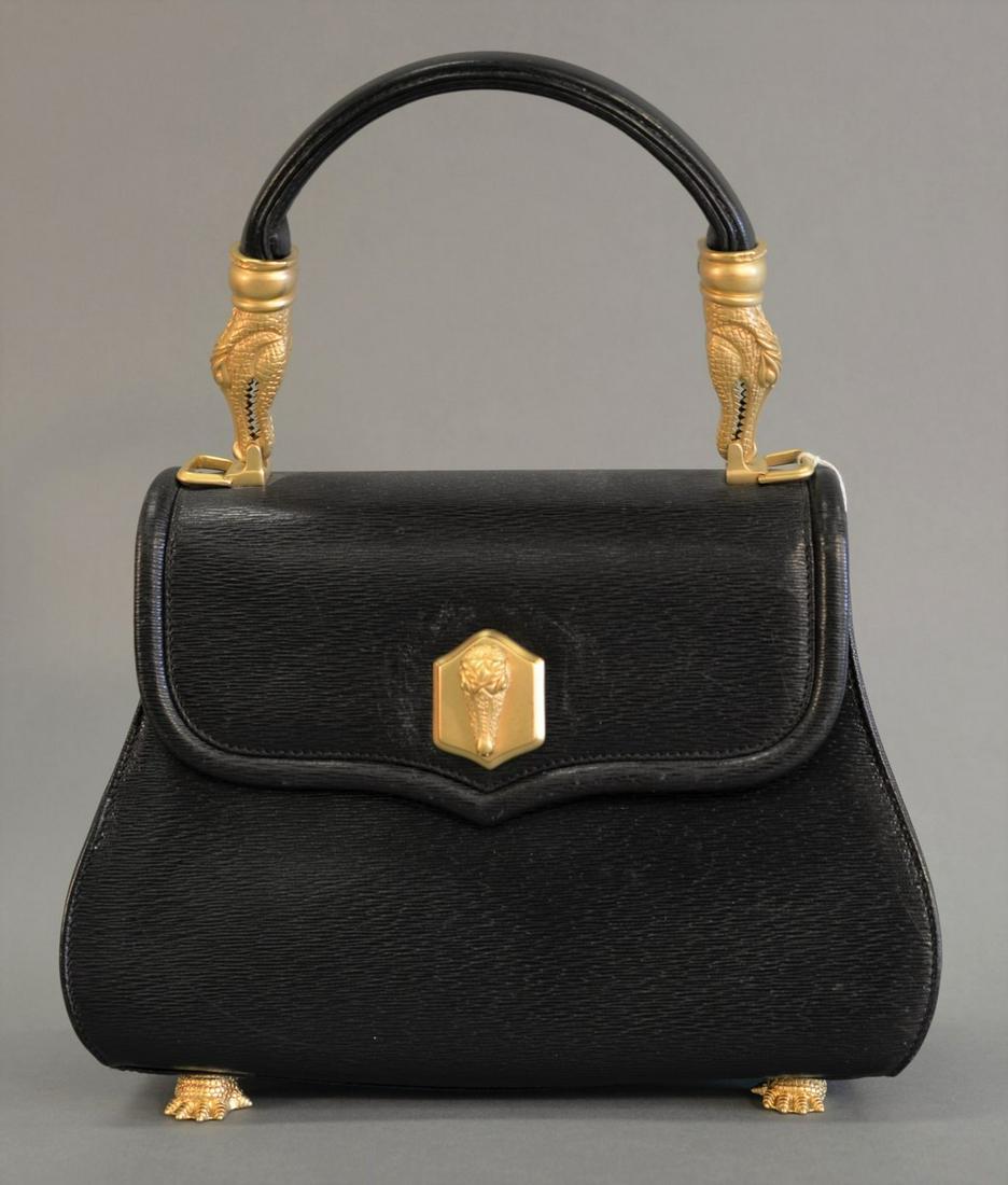 Barry Kieselstein-Cord black leather handbag, alligator: Barry Kieselstein-Cord black leather handbag, alligator clasp and handle mounts, turn lock closure, rests on alligator feet, green suede interior, signed brass plate to interior, dated 1990 on feet st