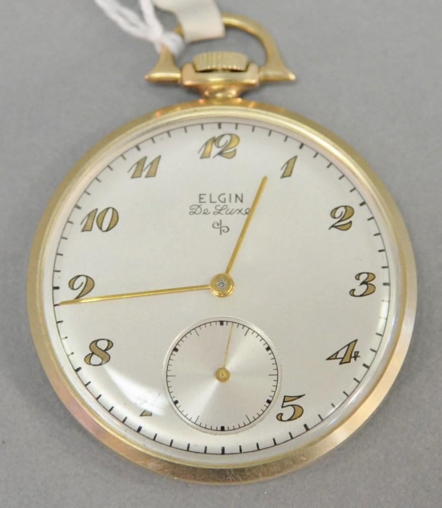 14k gold Elgin Deluxe open face pocket watch, 43mm: 14k gold Elgin Deluxe open face pocket watch, 43mm total weight, 1.5 t.oz. back cover monogrammed "25 Years Service Royal Typewriter".