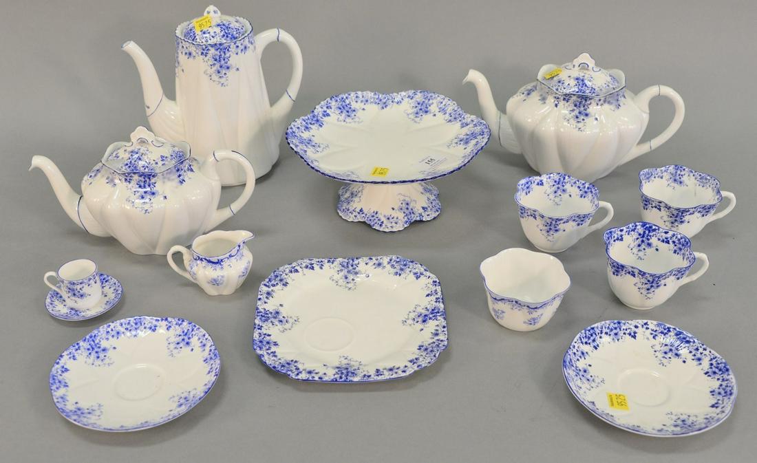 Two tray lot: Shelley "Dainty Blue" partial tea set,: Two tray lot: Shelley "Dainty Blue" partial tea set, thirteen pieces, English, includes: two tea pots, one coffee pot, four cups, two saucers, one snack tray, cake plate, creamer and a small cup and s