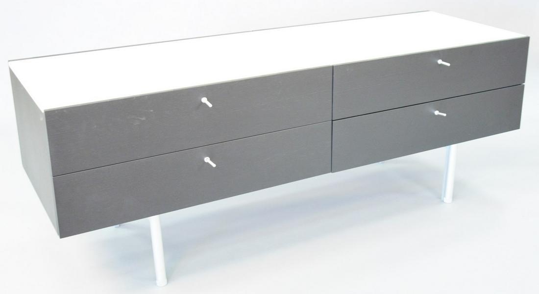 Cassina sideboard by Piero Lissoni, black with white: Cassina sideboard by Piero Lissoni, black with white marble top, four drawers, on chrome legs, 25 1/2" h., top 71" x 24".