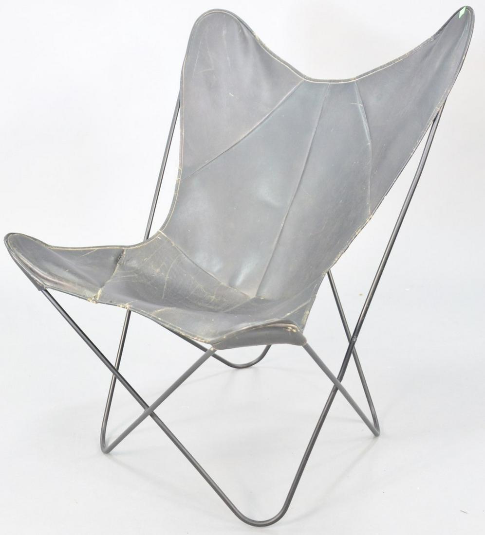 Hardoy/Knoll style butterfly chair, black leather,: Hardoy/Knoll style butterfly chair, black leather, tubular metal frame, unmarked, wear to leather including loss and tear, 35" h., 30 1/2" w., 15 1/2" d. (seat). Provenance: The Estate of Andrew Wolf,