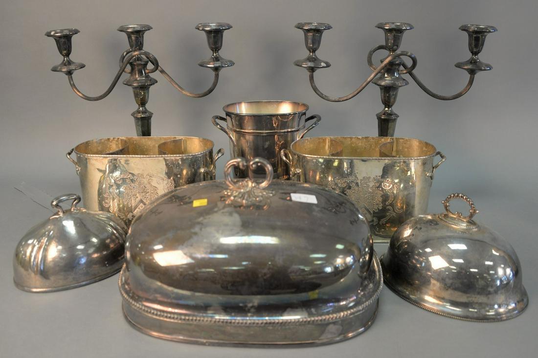 Silver plated group to include pair of double wire: Silver plated group to include pair of double wire bottle holders, pair candelabras, three entree serving covers and a single wine cooler, tallest: 16" h.