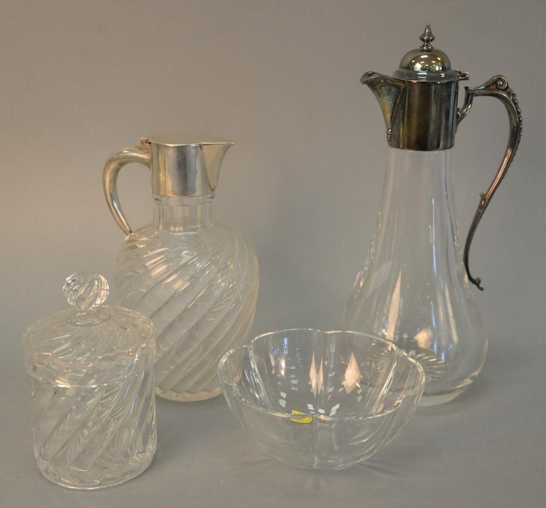 Four crystal pieces to include Baccarat jar and bowl: Four crystal pieces to include Baccarat jar and bowl and two pitchers with silver tops, tallest: 12" h. [Provenance: Estate of William and Teresa Patton, Lake Ave Greenwich, CT].