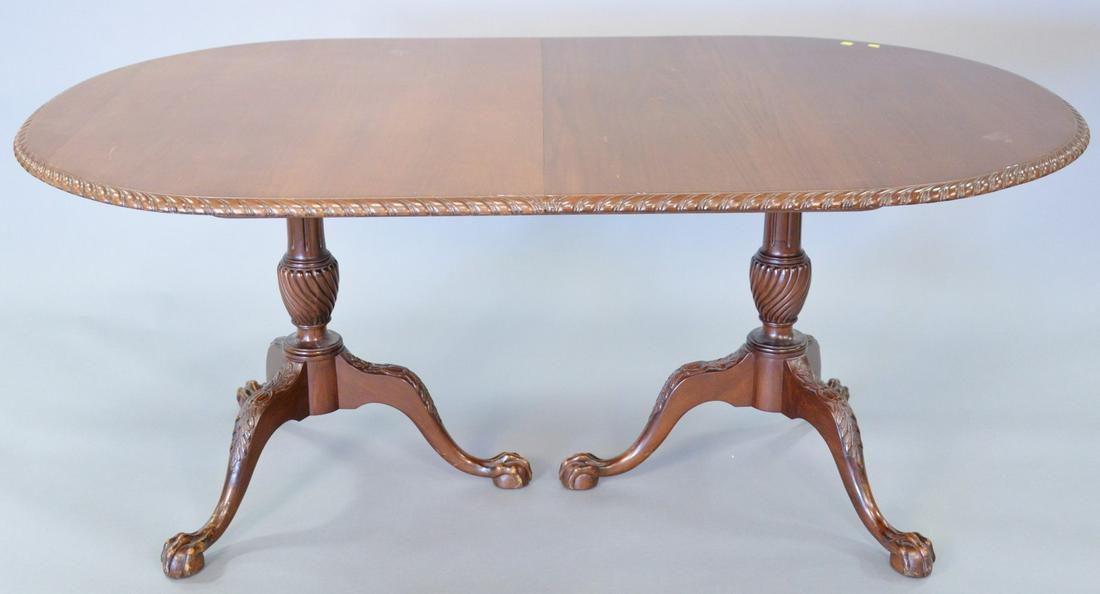 Custom mahogany oval double pedestal dining table with: Custom mahogany oval double pedestal dining table with ball and claw feet and rope edge, 29" h., top 43" x 69"; open 43" x 109".