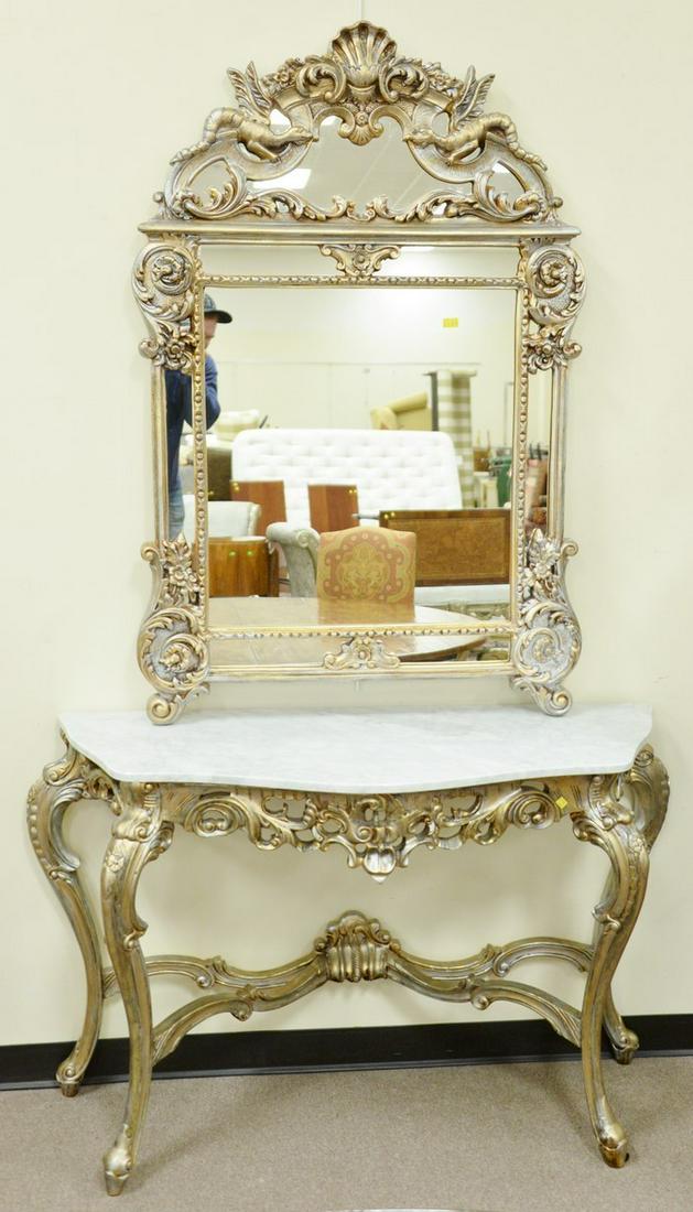 Two piece Louis XV style silver gilt console table with: Two piece Louis XV style silver gilt console table with marble top and mirror with dragons, mirror 57" x 37" x 34 1/2" h. x 51" w. x 19" d.