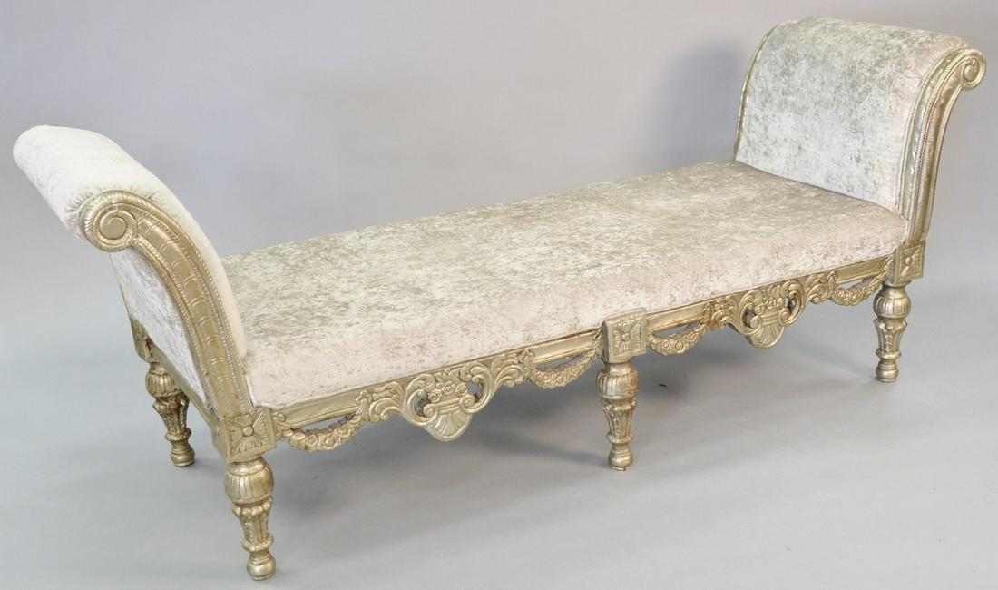Carved and embossed silver gilt benche, highly carved: Carved and embossed silver gilt benche, highly carved in Renaissance style with scrolls and swags, with silver faux snake upholstery, ht. 33 1/2", wd. 86', dp. 28".