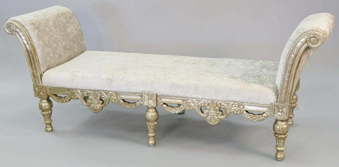 Pair of carved and embossed silver gilt benche, highly: Pair of carved and embossed silver gilt benche, highly carved in Renaissance style with scrolls and swags, with silver faux snake upholstery, ht. 33 1/2", wd. 86', dp. 28".