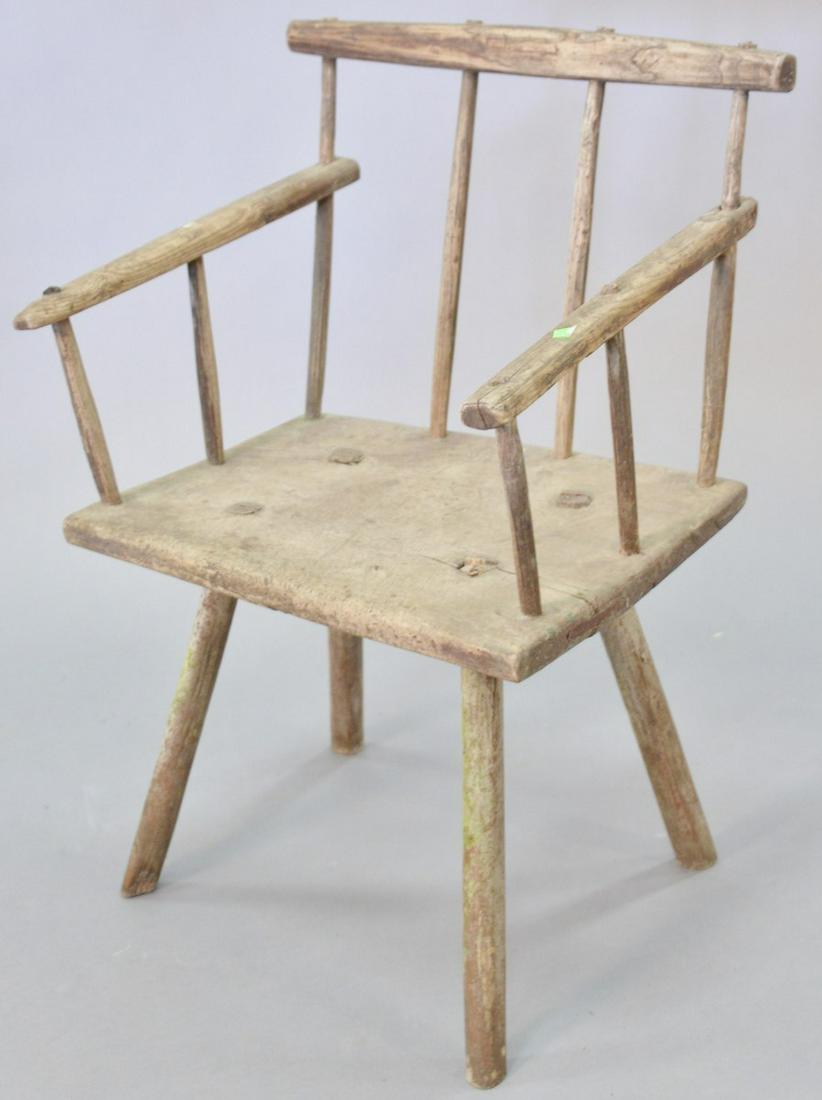 Primitive plank seat arm chair, English or French, 18th: Primitive plank seat arm chair, English or French, 18th C., seat height 16", 31" h., Provenance: Former home of Mel Gibson, Old Mill Rd, Greenwich, CT.