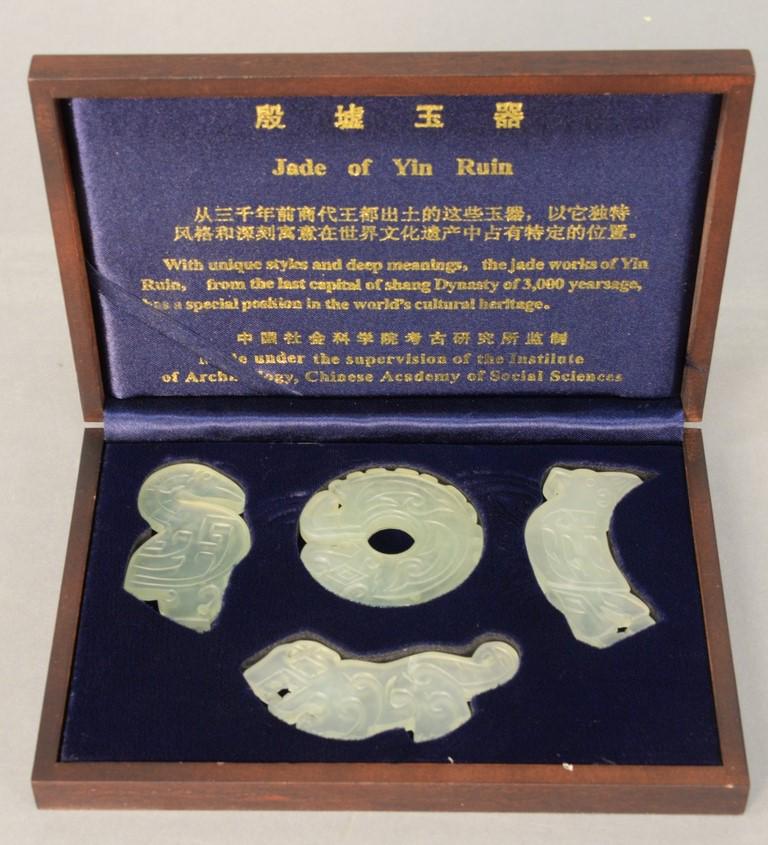 Jade of Yin Ruin, four piece carved group in fitted (1 of 3)