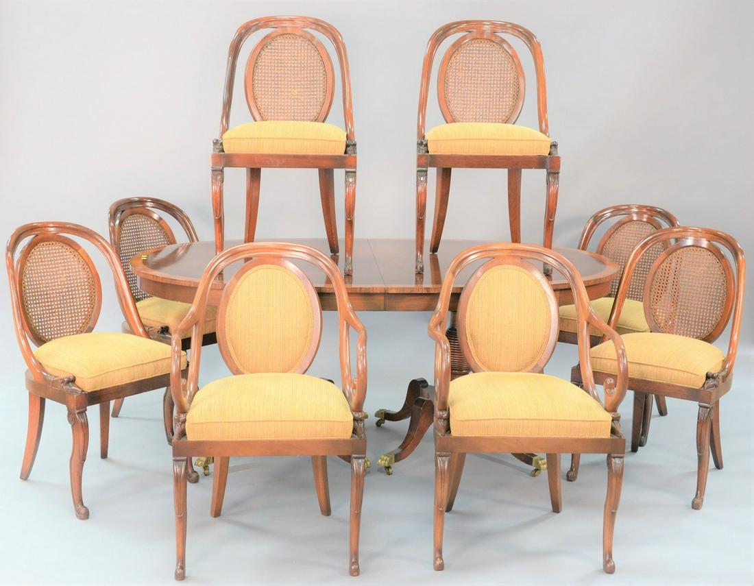 Nine piece mahogany dining room set to include oval: Nine piece mahogany dining room set to include oval banded, inlaid table, 2 arm chairs, 6 side chairs, all with caned back and goosehead supports, ht. 30", two leaves 18" each, open table with leaves