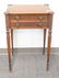 Sheraton mahogany two drawer stand with turret corners,