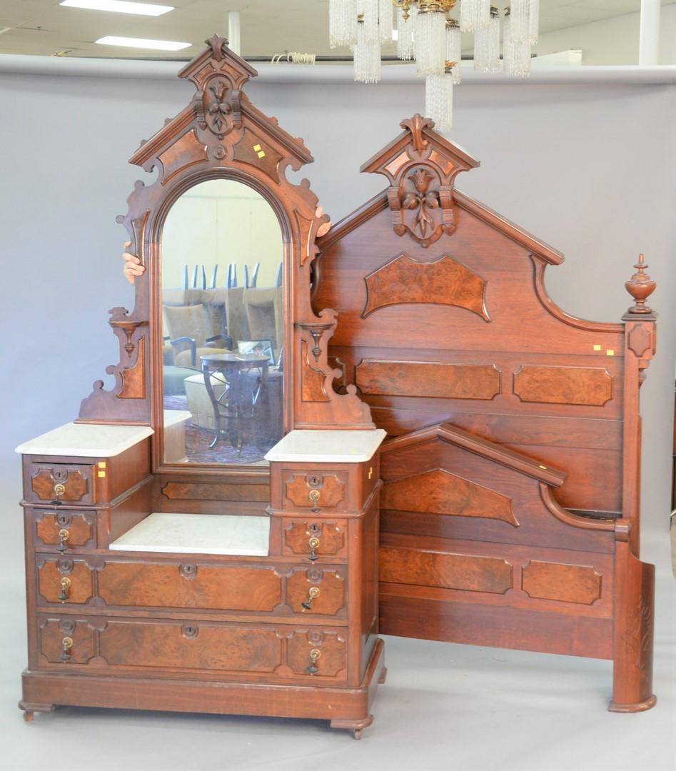 Two-piece walnut Victorian bedroom set with dropwell: Two-piece walnut Victorian bedroom set with dropwell marble top chest, ht. 82", wd. 47", and high back bed, ht. 79".