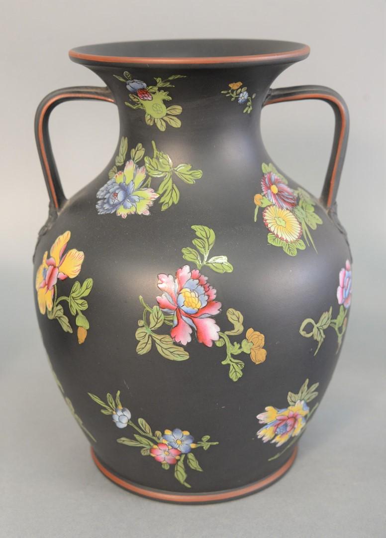 Large Wedgwood black basalt urn/vase, having two: Large Wedgwood black basalt urn/vase, having two handles and enameled blossoming flowers, impressed Wedgwood mark on bottom. ht. 10". Provenance: The Estate of Ed Brenner, Short Hills N.J.