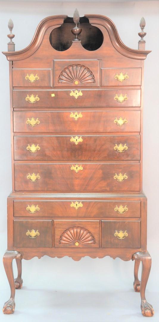Chippendale style mahogany highboy in 2 parts with full: Chippendale style mahogany highboy in 2 parts with full bonnet top and ball and claw feet (made up of older elements), ht. 83", wd. 41".