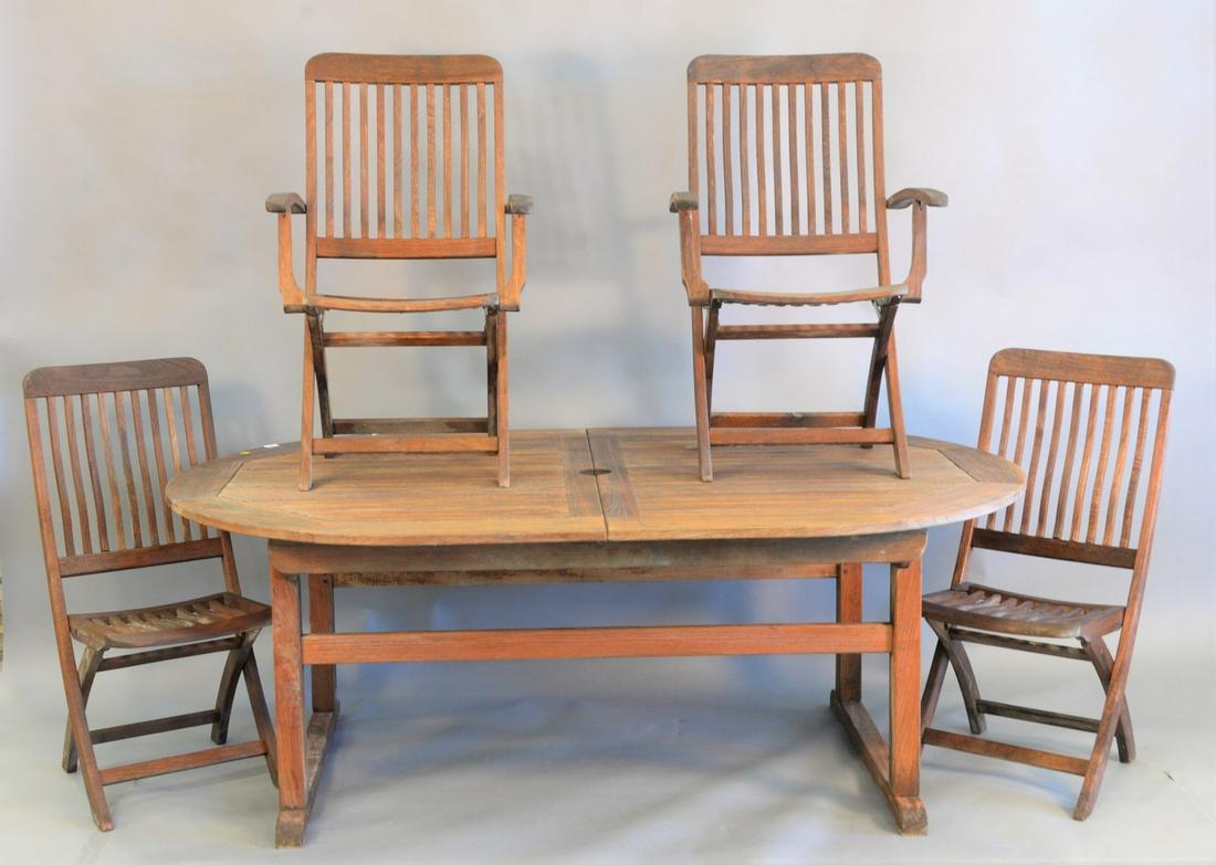 Six piece outdoor teak patio set to include Kingsley: Six piece outdoor teak patio set to include Kingsley Bate table (with leaf insert) along with 4 folding chairs and umbrella, ht. 29", top 50" x 78", open top 50" x 100".