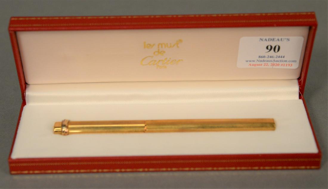 Cartier Les Must gold plated ballpoint pen in original: Cartier Les Must gold plated ballpoint pen in original box.