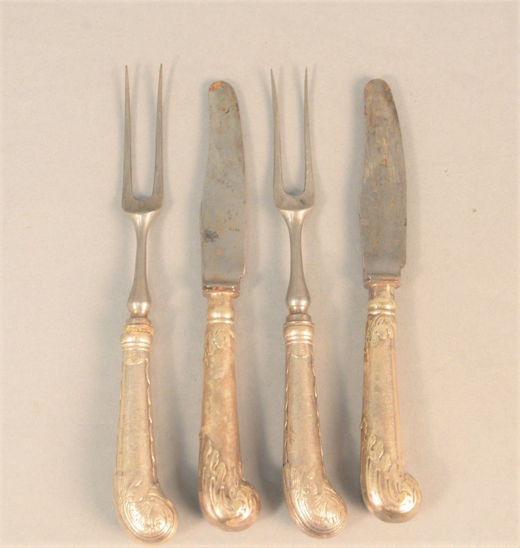 Forty-eight piece lot of silver handle knives and: Forty-eight piece lot of silver handle knives and two-tine forks, forty-four with pistol grips, mostly English along with Wallace silverplate flatware set.