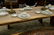 Exotic free-edge wood slab dining table in the manner - 4