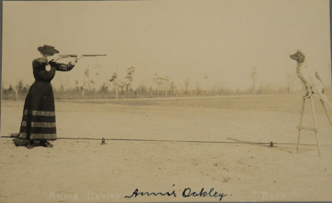 Postcard of Annie Oakley shooting apple off head of (1 of 4)