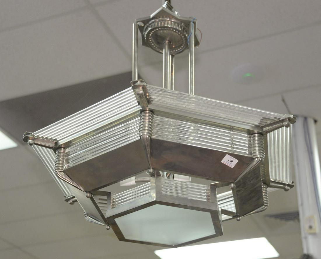 Contemporary stainless and glass hanging light.: Contemporary stainless and glass hanging light. ht. 25", dia. 32".