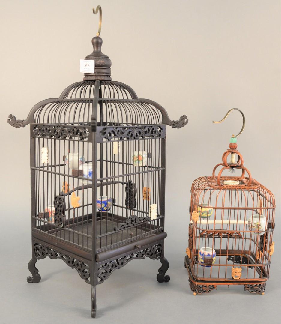 Two Chinese bird cages having porcelain water and food (1 of 5)