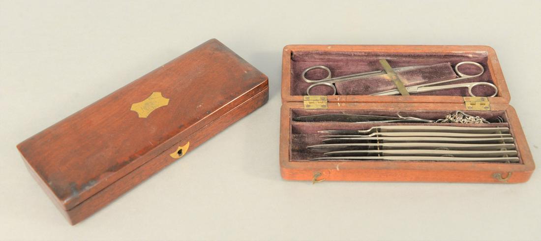 Two Field Surgical Kits, Sheffield and Edinburgh, each: Two Field Surgical Kits, Sheffield and Edinburgh, each having fitted interior with scalpels, scissors and tweezers.length: 7 1/2" each.Provenance: From the Robert Circiello Collection, West Hartford, 