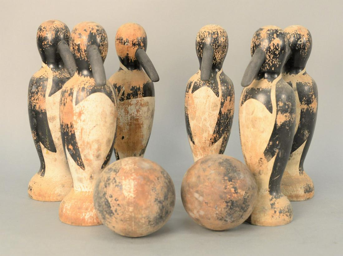 Set of Six Turned and Painted Wood Penguin-form Bowling: Set of Six Turned and Painted Wood Penguin-form Bowling Pins with two balls.pin height 12 inches.Provenance: The Estate of Diana Atwood Johnson