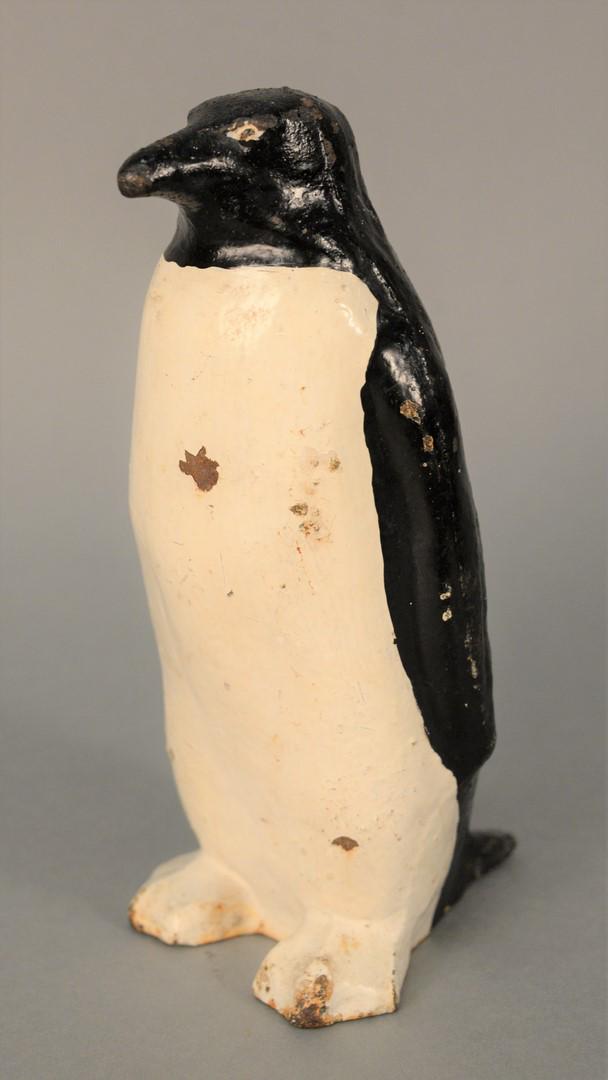 Cast Iron Penguin Door Stop in original paint with: Cast Iron Penguin Door Stop in original paint with hollow body.height 10 inches, width 5 inches.Provenance: The Estate of Diana Atwood Johnson