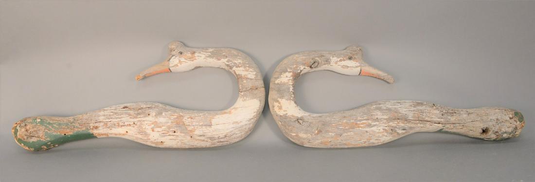 Wall Hanging Swans with very old crazed paint complete: Wall Hanging Swans with very old crazed paint complete with worm holes or shot holes and vestiges of original paint.length 35 inches, width 13 inches. Provenance: From the Marjorie & Howard Drubner Co