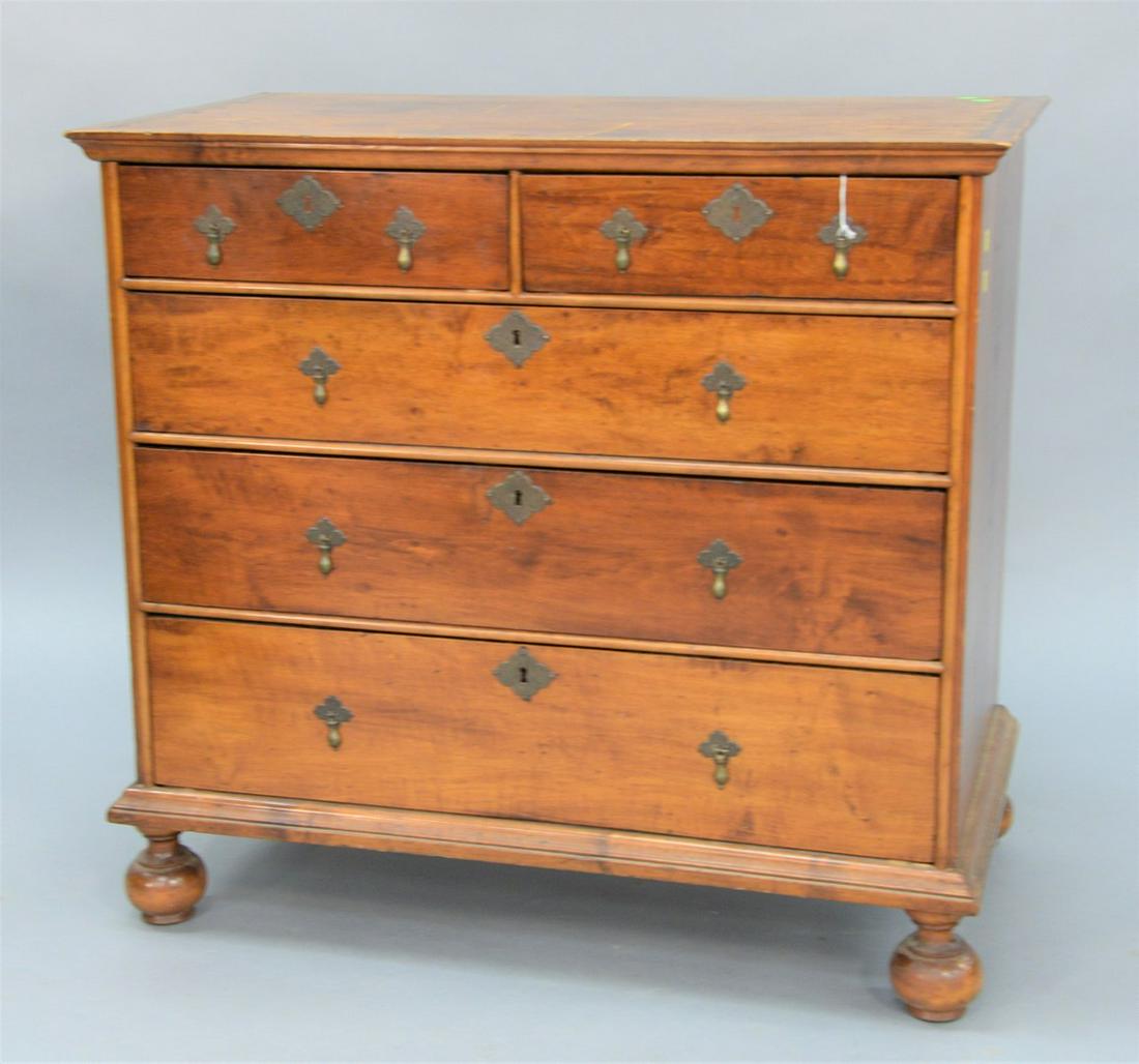 Queen Anne Chest, having cornice molded top over two: Queen Anne Chest, having cornice molded top over two short drawers over three drawers all set on round bun feet, having original brasses, circa 1740.height 35 inches, width 35 1/2 inches.Provenance: E
