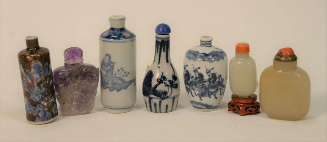 Group of Seven Snuff Bottles, to include two jade or: Group of Seven Snuff Bottles, to include two jade or hardston; one purple quartz; three blue and white along with blue and brown with painted koi fish.tallest in height 3 3/4 inches. Provenance: From