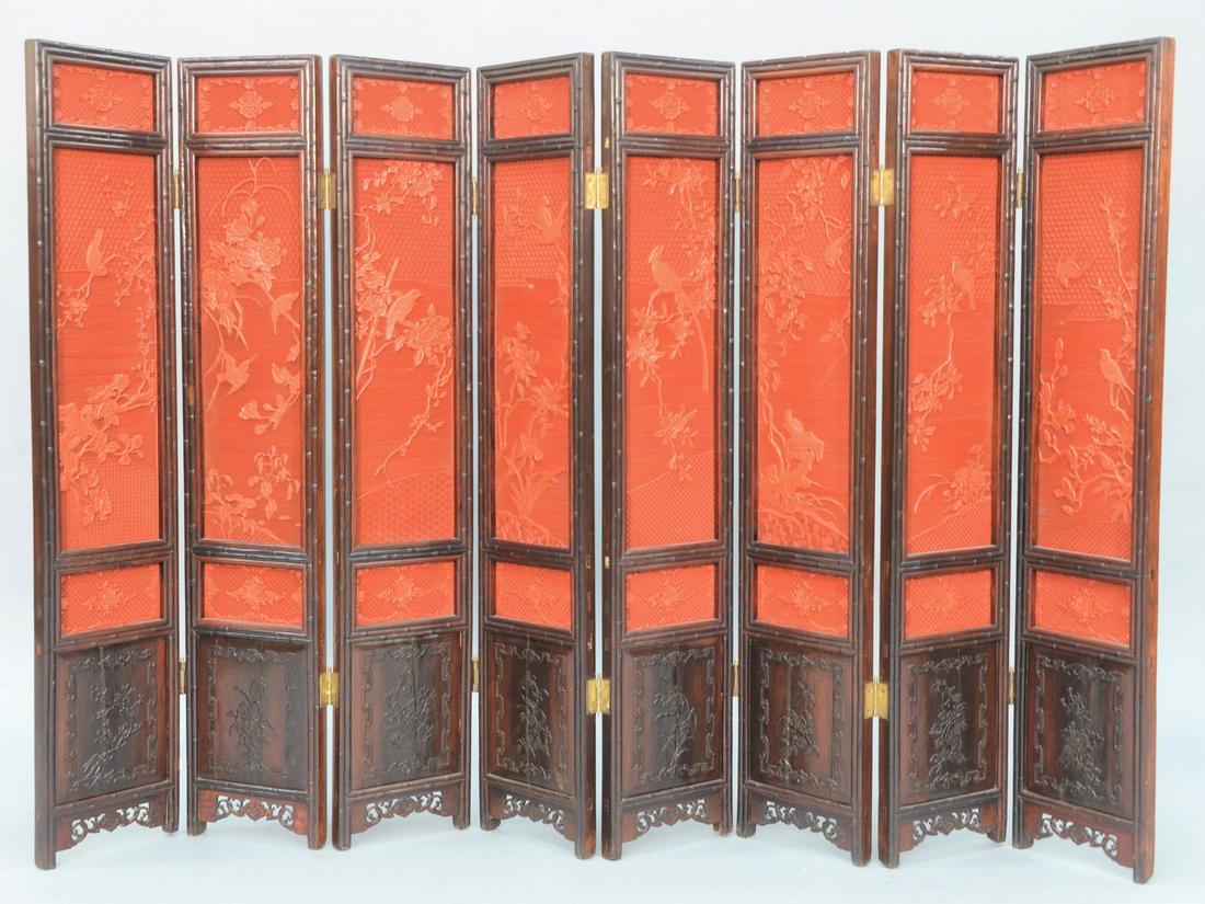Chinese Eight Panel Cinnabar Screen, each panel having: Chinese Eight Panel Cinnabar Screen, each panel having three carved cinnabar panels depicting birds and trees, with bamboo carved surrounds, intricately carved bottom panels, 19th century or earlier. 