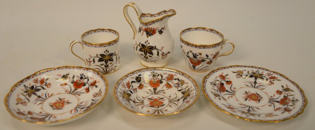 Fifty-nine Piece Set of Minton China having blue and: Fifty-nine Piece Set of Minton China having blue and iron red flowers with gilt border, marked with blue Minton's England mark to include seven bowls; twelve bread plates; twelve shallow bowls; five s