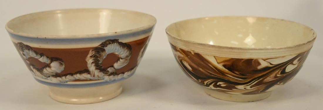 Two Pearlware Mocha Bowls, to include one with: Two Pearlware Mocha Bowls, to include one with tri-colored cable or worm decoration, height 3 1/4 inches, diameter 6 1/2 inches, the other with marbleized brown and yellow, height 3 inches, diameter 6